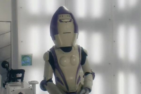 Trine-E played by Trinny Woodall (Voice) in Doctor Who: Series 1